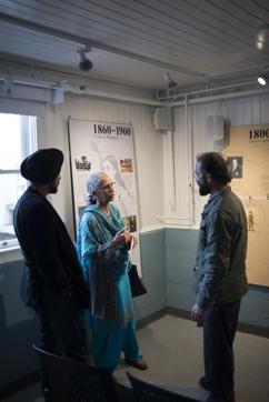Satwinder Bains (centre), director of the Centre for Indo-Canadian Studies, speaks to visitors at the inauguration of the exhibition, (Dis) Enfranchisement 1907-1947: The Forty-Year Struggle for The Vote. (Diego Slosse)