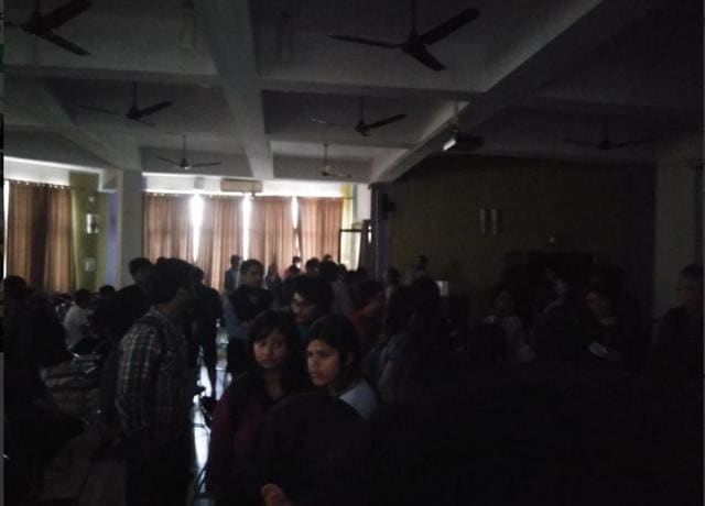 Students stranded inside the auditorium at Ramjas college after ABVP activists hurled stones at them for inviting Umar Khalid to campus, on February 21, 2017. (Dhrubo Jyoti/Hindustan Times)