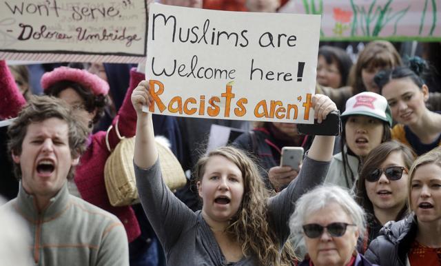 Demonstrators hold a rally in Salt Lake City. (AP Photo) Demonstrators hold a rally in Salt Lake City. (AP Photo)