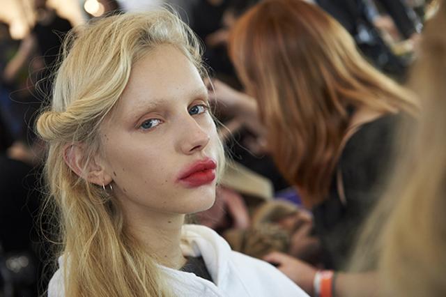 A model is prepared backstage before the catwalk show from Preen by Thornton Bregazzi. A model is prepared backstage before the catwalk show from Preen by Thornton Bregazzi.