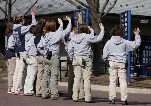 Zoo keepers wave as giant panda Bao Bao leaves for her new home in China from the National Zoo in Washington, DC, on February 21. (Reuters Photo) Zoo keepers wave as giant panda Bao Bao leaves for her new home in China from the National Zoo in Washington, DC, on February 21. (Reuters Photo)