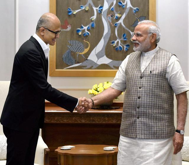 Prime Minister Narendra Modi shakes hands with Satya Nadella during a meeting in New Delhi. (PTI Photo) Prime Minister Narendra Modi shakes hands with Satya Nadella during a meeting in New Delhi. (PTI Photo)
