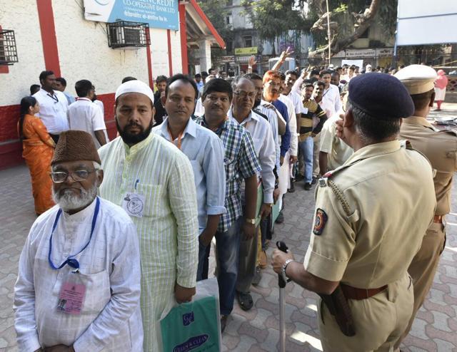 Polling agents in a line to outside a counting centre at Dr Antonia High School in Dadar, Mumbai, on Thursday. (Kunal Patil/HT Photo) Polling agents in a line to outside a counting centre at Dr Antonia High School in Dadar, Mumbai, on Thursday. (Kunal Patil/HT Photo)