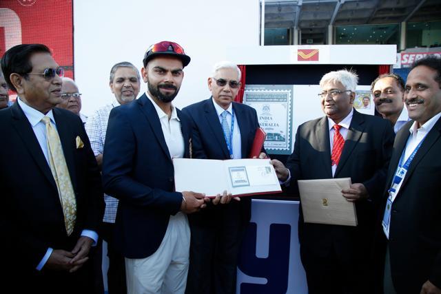 Virat Kohli was presented with a commemorative stamp in Pune’s first-ever Test match as the India vs Australia series began. (BCCI)