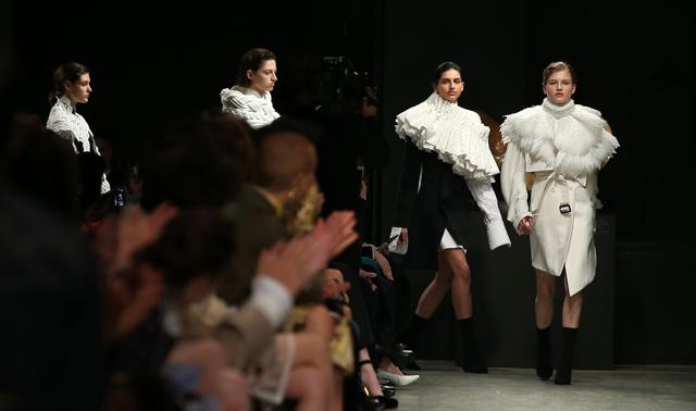Models present creations from the Burberry collection during a catwalk show on the fourth day of the Autumn/Winter 2017 London Fashion Week in London on Monday. (AFP) Models present creations from the Burberry collection during a catwalk show on the fourth day of the Autumn/Winter 2017 London Fashion Week in London on Monday. (AFP)