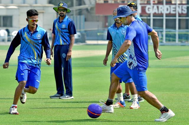 Jharkhand captain Mahendra Singh Dhoni playing soccer with his teammates during a training session at Eden Garden in Kolkata on Thursday (PTI) Jharkhand captain Mahendra Singh Dhoni playing soccer with his teammates during a training session at Eden Garden in Kolkata on Thursday (PTI)