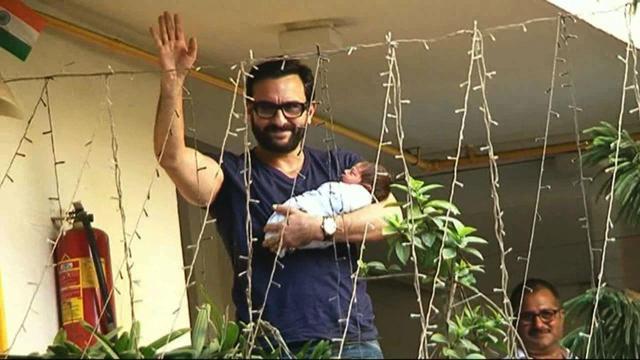 Saif Ali Khan poses with his newborn boy Taimur at their residence in Mumbai. (IANS)