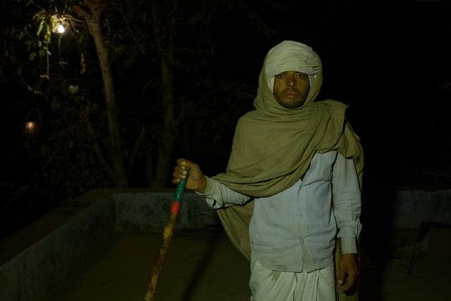 Chhotelal Meena, standing guard outside his house in Sili Baodi in Alwar. (HT Photo) Chhotelal Meena, standing guard outside his house in Sili Baodi in Alwar. (HT Photo)