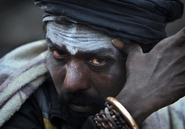 A sadhu smears his forehead with ash at the courtyard of the Pashupatinath temple in Kathmandu during Mahashivratri on Friday. (AP) A sadhu smears his forehead with ash at the courtyard of the Pashupatinath temple in Kathmandu during Mahashivratri on Friday. (AP)