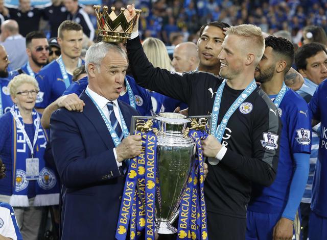 In this May 7, 2016 file photo, Leicester City team manager Claudio Ranieri has the crown of the trophy placed on his head by Leicester goalkeeper Kasper Schmeichel as they celebrate becoming the Premier League. (AP) In this May 7, 2016 file photo, Leicester City team manager Claudio Ranieri has the crown of the trophy placed on his head by Leicester goalkeeper Kasper Schmeichel as they celebrate becoming the Premier League. (AP)