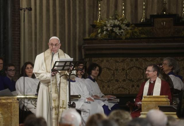 Pope Francis delivers a speech as Robert Innes (right), the Anglican Bishop in Europe, listens during the pope’s historic visit to the Anglican Church of All Saints in Rome on Sunday. (AP)
