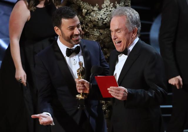 Jimmy Kimmel and Warren Beatty laugh after correcting the Best Picture Oscar from La La Land to Moonlight. (REUTERS)