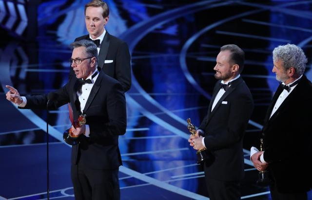 Kevin O’Connell, Andy Wright, Robert Mackenzie and Peter Grace of Hacksaw Ridge accept the Oscar for Achievement in Sound Mixing. (REUTERS) Kevin O’Connell, Andy Wright, Robert Mackenzie and Peter Grace of Hacksaw Ridge accept the Oscar for Achievement in Sound Mixing. (REUTERS)