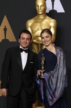 Anousheh Ansari and Firouz Naderi, a former NASA director, pose with the Oscar they accepted on behalf of Asghar Farhadi, who won the Best Foreign Language Film for The Salesman. (Reuters) Anousheh Ansari and Firouz Naderi, a former NASA director, pose with the Oscar they accepted on behalf of Asghar Farhadi, who won the Best Foreign Language Film for The Salesman. (Reuters)