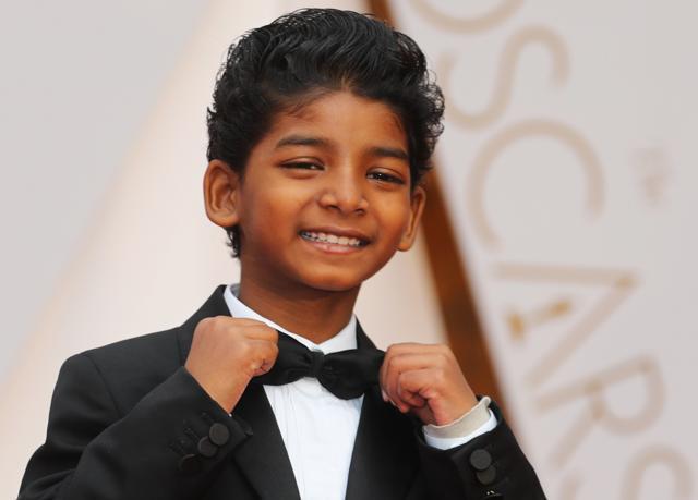 Actor Sunny Pawar of Lion wore a black tuxedo and completed his look with a green and yellow sneakers. (REUTERS) Actor Sunny Pawar of Lion wore a black tuxedo and completed his look with a green and yellow sneakers. (REUTERS)