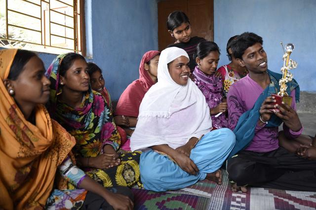 Tanuja Khatun (in white), a 17-year-old who was felicitated by the Bengal government and who is a member of the children’s team against trafficking, shows her trophy to other members. (Subhankar Chakraborty/HT Photo) Tanuja Khatun (in white), a 17-year-old who was felicitated by the Bengal government and who is a member of the children’s team against trafficking, shows her trophy to other members. (Subhankar Chakraborty/HT Photo)