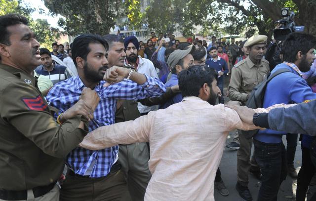 Activists being detained by police. (Karun Sharma/HT Photo)