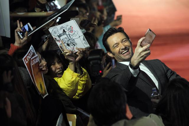 Australian actor Hugh Jackman cheers with fans during a media event promoting his American superhero film Logan in Taipei, Taiwan. (AP) Australian actor Hugh Jackman cheers with fans during a media event promoting his American superhero film Logan in Taipei, Taiwan. (AP)