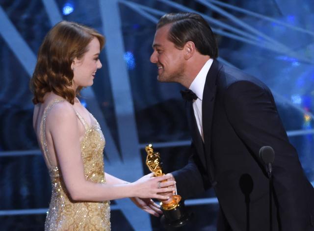 Leonardo DiCaprio, right, presents Emma Stone with the award for best actress in a leading role for La La Land at the Oscars. (Chris Pizzello/Invision/AP) Leonardo DiCaprio, right, presents Emma Stone with the award for best actress in a leading role for La La Land at the Oscars. (Chris Pizzello/Invision/AP)