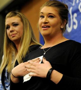 Laura Grillot (right) and her sister Maggie talk about their brother Ian, who was injured while trying to stop a gunman who killed Indian engineer Srinivas Kuchibhotla at a local bar, during a vigil in Olathe, Kansason Sunday. (Reuters) Laura Grillot (right) and her sister Maggie talk about their brother Ian, who was injured while trying to stop a gunman who killed Indian engineer Srinivas Kuchibhotla at a local bar, during a vigil in Olathe, Kansason Sunday. (Reuters)