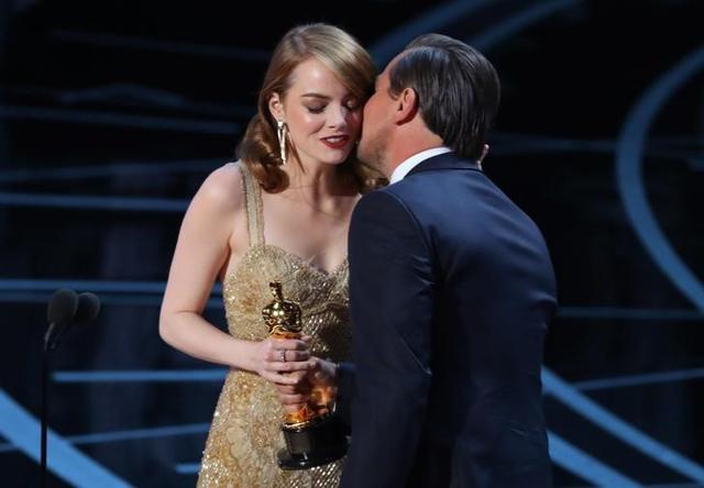 Best Actress winner Emma Stone is congratulated by Leonardo DiCaprio as she accepts her award for La La Land. (Reuters) Best Actress winner Emma Stone is congratulated by Leonardo DiCaprio as she accepts her award for La La Land. (Reuters)