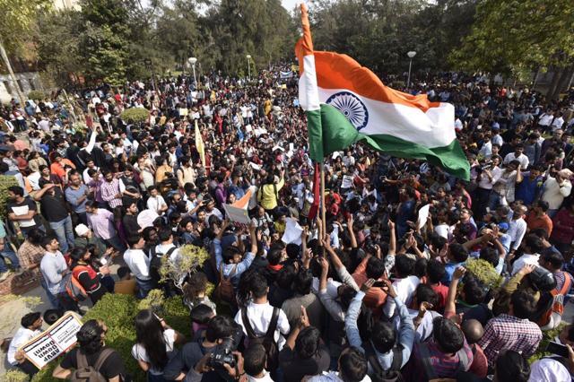 Students wave the national flag as they shout slogans ABVP members. (Raj K Raj / HT Photo ) Students wave the national flag as they shout slogans ABVP members. (Raj K Raj / HT Photo )