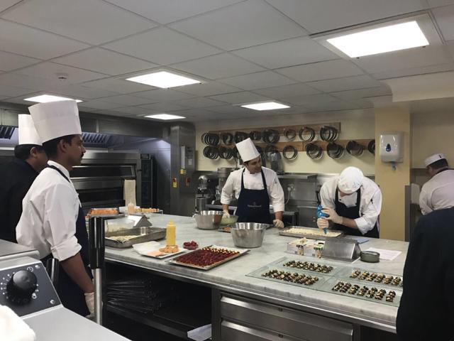 Indian and British chefs preparing India-themed canapes in the royal kitchen. (HT Photo) Indian and British chefs preparing India-themed canapes in the royal kitchen. (HT Photo)