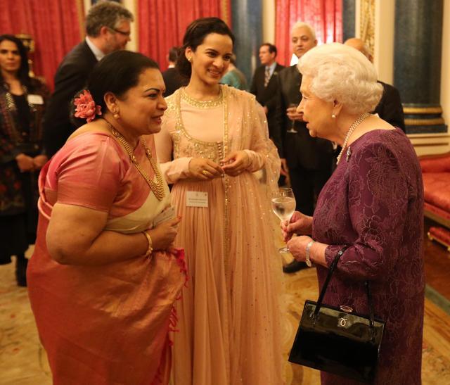 Britain's Queen Elizabeth II (R) attends a reception to mark the launch of the UK-India Year of Culture 2017 at Buckingham Palace in London on February 27, 2017. (AFP)