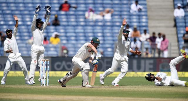 (From left) Ajinkya Rahane, Wriddhiman Saha, Murali Vijay and Cheteshwar Pujara appeal successfully for a LBW decision against Australia's Shaun Marsh on Day 2 of the first Test match between India and Australia at the Maharashtra Cricket Association Stadium in Pune on February 24, 2017. (AFP)