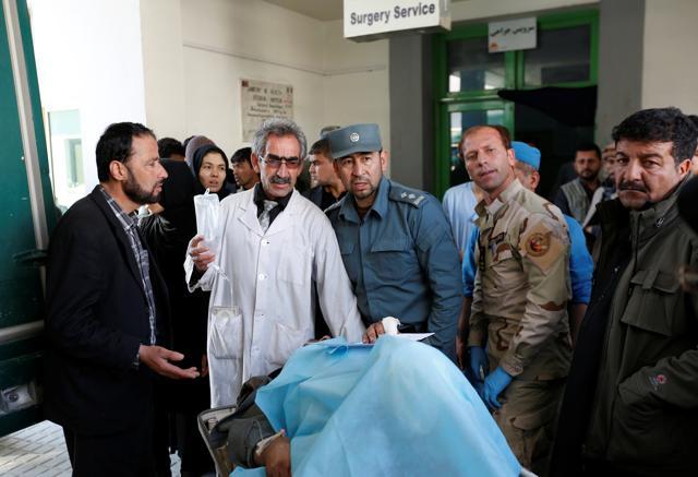Doctors attend to an injured man at a hospital after the attacks in Kabul. (REUTERS)