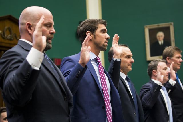 From left: Olympians Adam Nelson and Michael Phelps, and Travis Tygart, the US top anti-doping official, are sworn during an Oversight and Investigations Subcommittee hearing on doping in Washington on Monday. (NYT) From left: Olympians Adam Nelson and Michael Phelps, and Travis Tygart, the US top anti-doping official, are sworn during an Oversight and Investigations Subcommittee hearing on doping in Washington on Monday. (NYT)