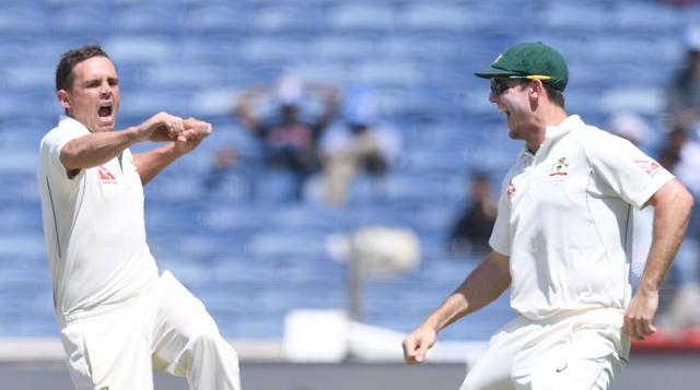 Australia's Steve O'Keefe (left) celebrates with teammate Mitchell Marsh after the dismissal of India's captain Virat Kohli on the third day of the first Test in Pune on February 25, 2017. (AFP) Australia's Steve O'Keefe (left) celebrates with teammate Mitchell Marsh after the dismissal of India's captain Virat Kohli on the third day of the first Test in Pune on February 25, 2017. (AFP)