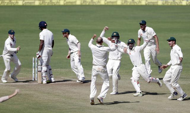 Australia's captain Steve Smith, left, David Warner, third left, and teammates celebrate after winning the first cricket test match against India. (AP) Australia's captain Steve Smith, left, David Warner, third left, and teammates celebrate after winning the first cricket test match against India. (AP)