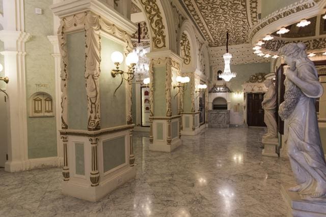 Brass lamps are mounted on lime green columns. (Aalok Soni/ HT Photo )