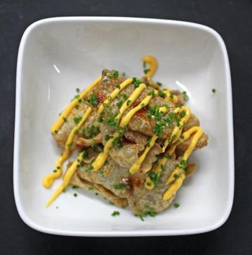 Drop’s deep-fried chicken-skin wafers hook you from the first bite. They’re part of an expansive appetisers section on the menu. (Satyabrata Tripathy/ Hindustan Times)