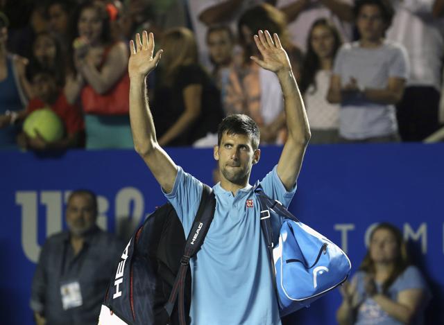 Novak Djokovic greets the crowd as he leaves the court after losing against Australia's Nick Kyrgios in Acapulco on Thursday. (AP) Novak Djokovic greets the crowd as he leaves the court after losing against Australia's Nick Kyrgios in Acapulco on Thursday. (AP)