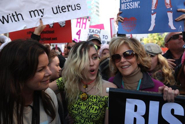 Actress Marcia Gay Harden, singer Miley Cyrus and Jane Fonda march during the Women's March on January 21 in Los Angeles, California. Tens of thousands of people took to the streets of Downtown Los Angeles for the Women's March in pro’test after the inauguration of President Donald Trump. (AFP) Actress Marcia Gay Harden, singer Miley Cyrus and Jane Fonda march during the Women's March on January 21 in Los Angeles, California. Tens of thousands of people took to the streets of Downtown Los Angeles for the Women's March in pro’test after the inauguration of President Donald Trump. (AFP)