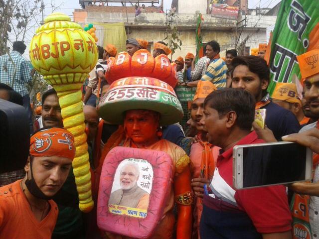 A BJP supporter dressed in an innovate headgear and attire sporting an image of Prime Minister Narendra Modi. A BJP supporter dressed in an innovate headgear and attire sporting an image of Prime Minister Narendra Modi.