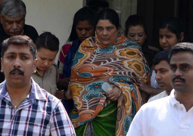 CID officials escort Chandana Chakraborty for an appearance at a court in Jalpaiguri on Saturday. (AFP) CID officials escort Chandana Chakraborty for an appearance at a court in Jalpaiguri on Saturday. (AFP)