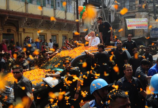 Prime Minister Narendra Modi during his roadshow in Varanasi on Saturday. (AFP)