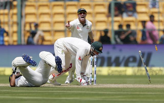 Australia's wicketkeeper Matthew Wade breaks the stumps to dismiss India's Ajinkya Rahane in Bangalore on Saturday. (AP) Australia's wicketkeeper Matthew Wade breaks the stumps to dismiss India's Ajinkya Rahane in Bangalore on Saturday. (AP)