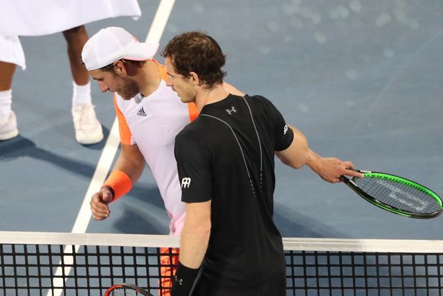 World number one Andy Murray of Great Britain shakes hands with France's Lucas Pouille following their ATP semi-final in Dubai on Friday. (AFP) World number one Andy Murray of Great Britain shakes hands with France's Lucas Pouille following their ATP semi-final in Dubai on Friday. (AFP)