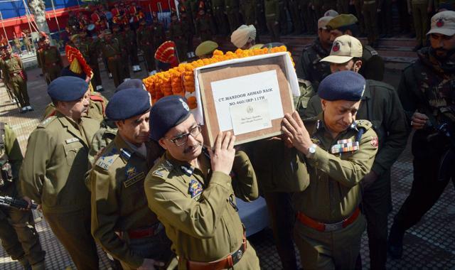 DGP and IGP of Jammu and Kashmir police along with senior officers carrying the body of constable Manzoor Ahmad who was killed during an encounter at Tral. (PTI Photo) DGP and IGP of Jammu and Kashmir police along with senior officers carrying the body of constable Manzoor Ahmad who was killed during an encounter at Tral. (PTI Photo)