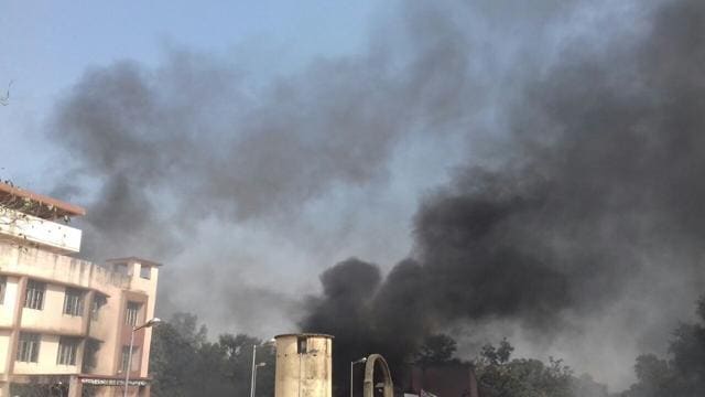 Smoke billowing out of the Barhara police station building in Ara. (HT photo ) Smoke billowing out of the Barhara police station building in Ara. (HT photo )