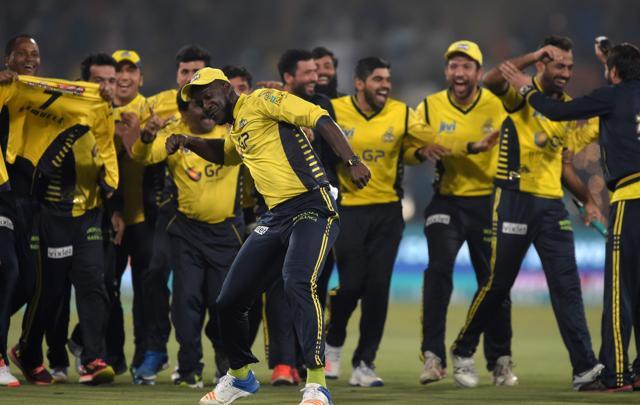 Peshawar Zalmi captain Darran Sammi (C) celebrates with teammates his team's victory over Quetta Gladiators in the final cricket match of the Pakistan Super League at the Gaddafi Cricket Stadium in Lahore on Sunday. (AFP) Peshawar Zalmi captain Darran Sammi (C) celebrates with teammates his team's victory over Quetta Gladiators in the final cricket match of the Pakistan Super League at the Gaddafi Cricket Stadium in Lahore on Sunday. (AFP)