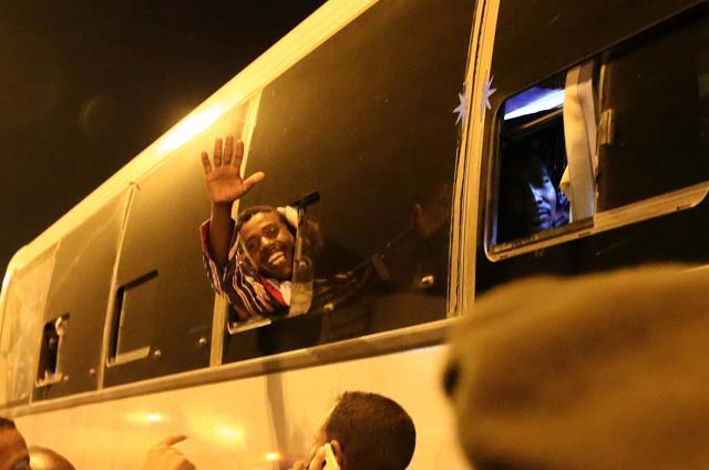 A member of the Sudanese armed forces waves inside a bus as 130 members arrive at Khartoum Airport, after being released by the Sudan People's Liberation Movement-North (SPLM-N) rebel group in South Kordofan, Sudan March 5. (Reuters Photo)