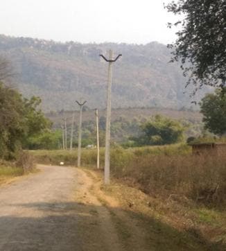 A subcontractor has laid out poles but there are no wires, in Belach village, Sonbhadra district, eastern Uttar Pradesh. Work has not progressed for the past four months, and the subcontractor has disappeared. (Mukta Patil/IndiaSpend)