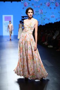 This one-shoulder dress by designer Anushree Reddy is feminine and flirty at the same time. The floral prints add freshness to this blush pink dress. Twirl around and celebrate this day. This one-shoulder dress by designer Anushree Reddy is feminine and flirty at the same time. The floral prints add freshness to this blush pink dress. Twirl around and celebrate this day.