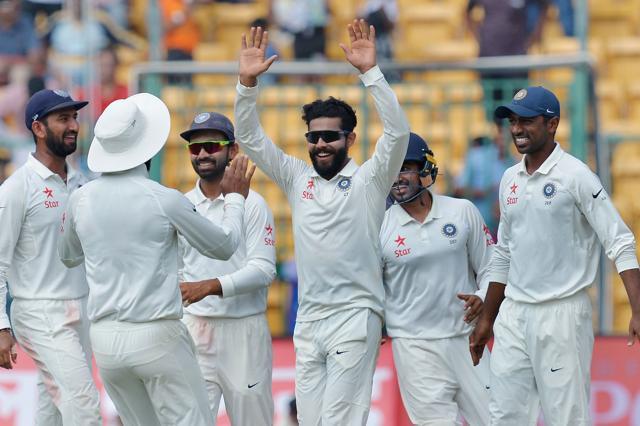 Ravindra Jadeja (C) celebrates with teammates after the dismissal of Australian batsman Stephen O'Keefe. (AFP)