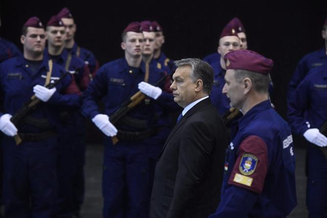 Hungarian Prime Minister Viktor Orban, 2nd right, attends a swearing-in ceremony of a new group of border guards, known locally as border hunters, in Budapest on Tuesday. (AP Photo) Hungarian Prime Minister Viktor Orban, 2nd right, attends a swearing-in ceremony of a new group of border guards, known locally as border hunters, in Budapest on Tuesday. (AP Photo)